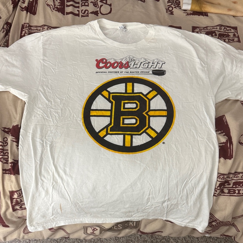 Delta White T-Shirt with Blue and Brown Logo